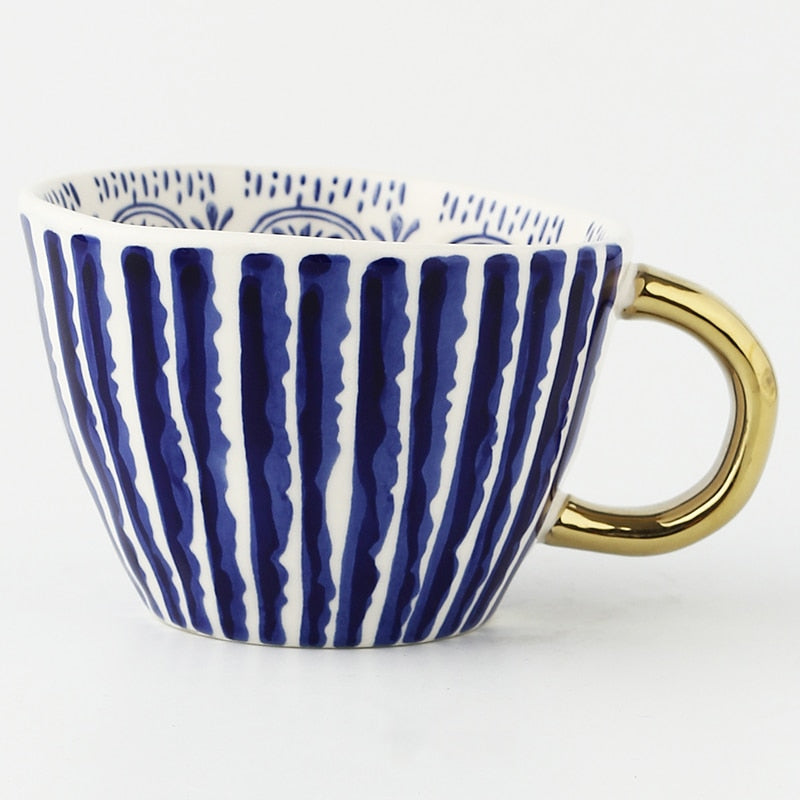 Abstract Geometric Pattern Cup with Gold Handle