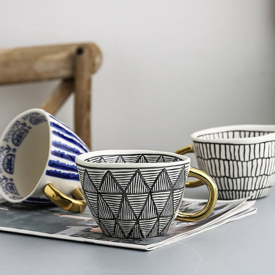 Abstract Geometric Pattern Cup with Gold Handle